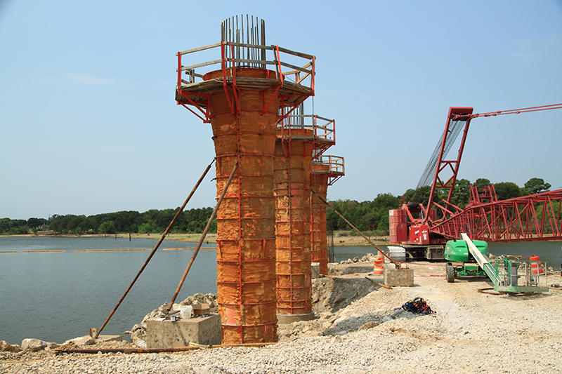 Examples of mass concrete placements include bridge piers, structural columns, mat slabs, girders, footings, and thick slabs